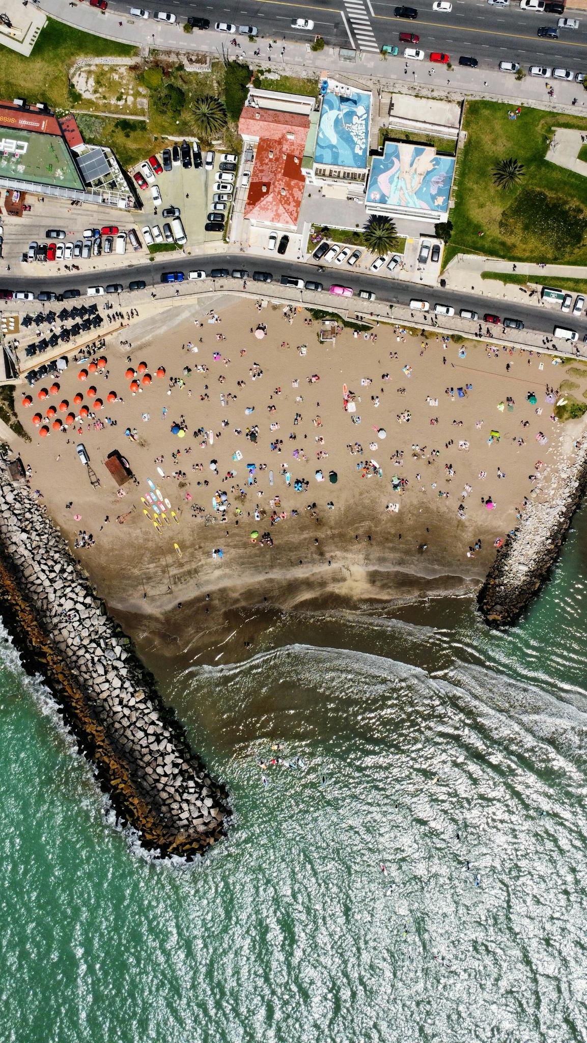 Stunning aerial view of Mar del Plata beach crowded with tourists enjoying the summer day.